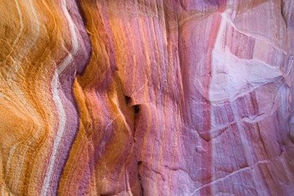 Layered sandstone in peach and violet